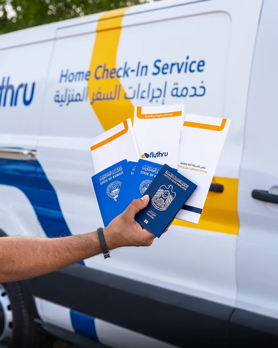 Passports and FlyThru boarding document wallets in front of the FlyThru van