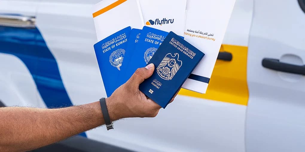 Passports and FlyThru boarding document wallets in front of the FlyThru van